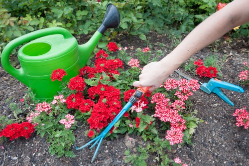 Landscaping crew working safely with tools and maintaining site order