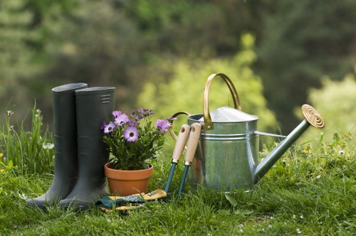 A tidy Kilburn outdoor space with paving, planting, and low-maintenance design